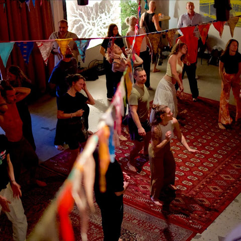 The dance floor through a string of colourful bunting