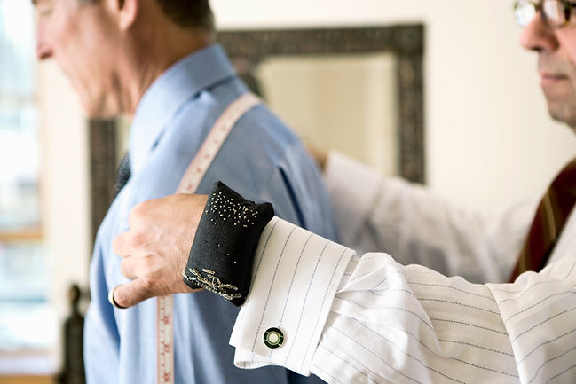 Tailor Measuring Shoulders for Man's Suit