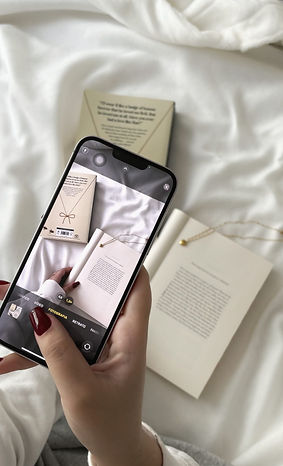Take a photo of the book on the bed