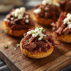 Mini wood-fired bites topped with tender roasted beef, creamy feta, and a touch of fresh h