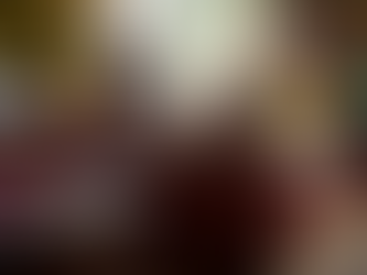 People sat around couches socialising in Castle Rock Hostel.