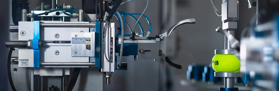 Automated machinery processing a yellow object.