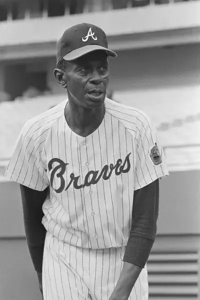 A legendary baseball player in his Braves uniform- Satchel Paige. Public domain archival photograph.