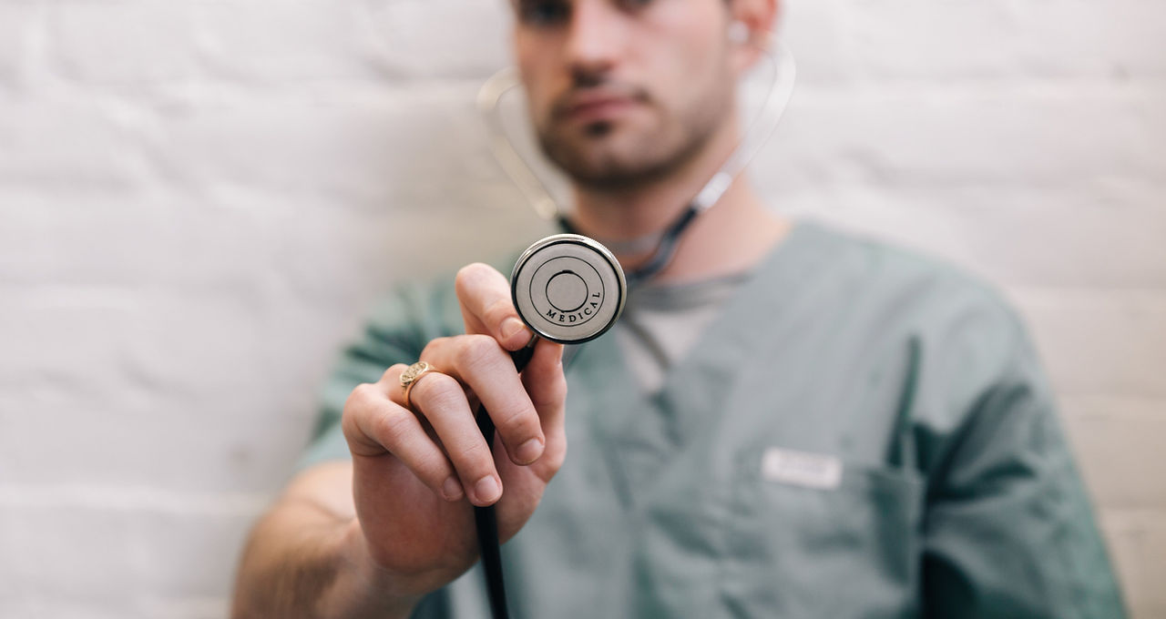A doctor holding a stethoscope