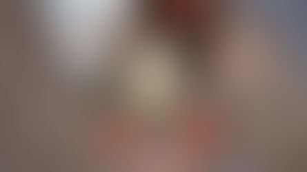 Eggnog in a glass with cinnamon sticks, surrounded by eggs, a milk bottle, and burlap fabric, creating a cozy, rustic vibe.