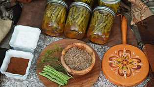 crisp, tangy green beans preserved in a flavorful vinegar brine with dill and savory spices.