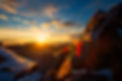 Flags of Tibetan prayers in the mountains with the colors of a warm sunset..jpg