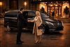 Luxury chauffeur service in Cardiff with professional driver greeting client beside Mercedes V-Class vehicle