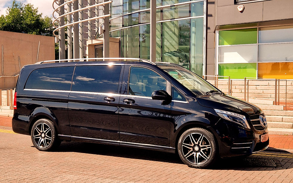 High angle view of a taxi waiting outside a busy train station