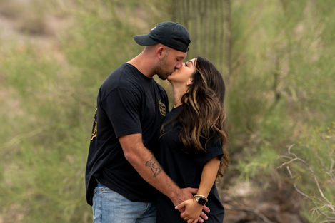 Engagement photography capturing natural connection and shared moments between a couple in an outdoor desert setting.