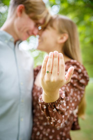 engaged couple showing off ring