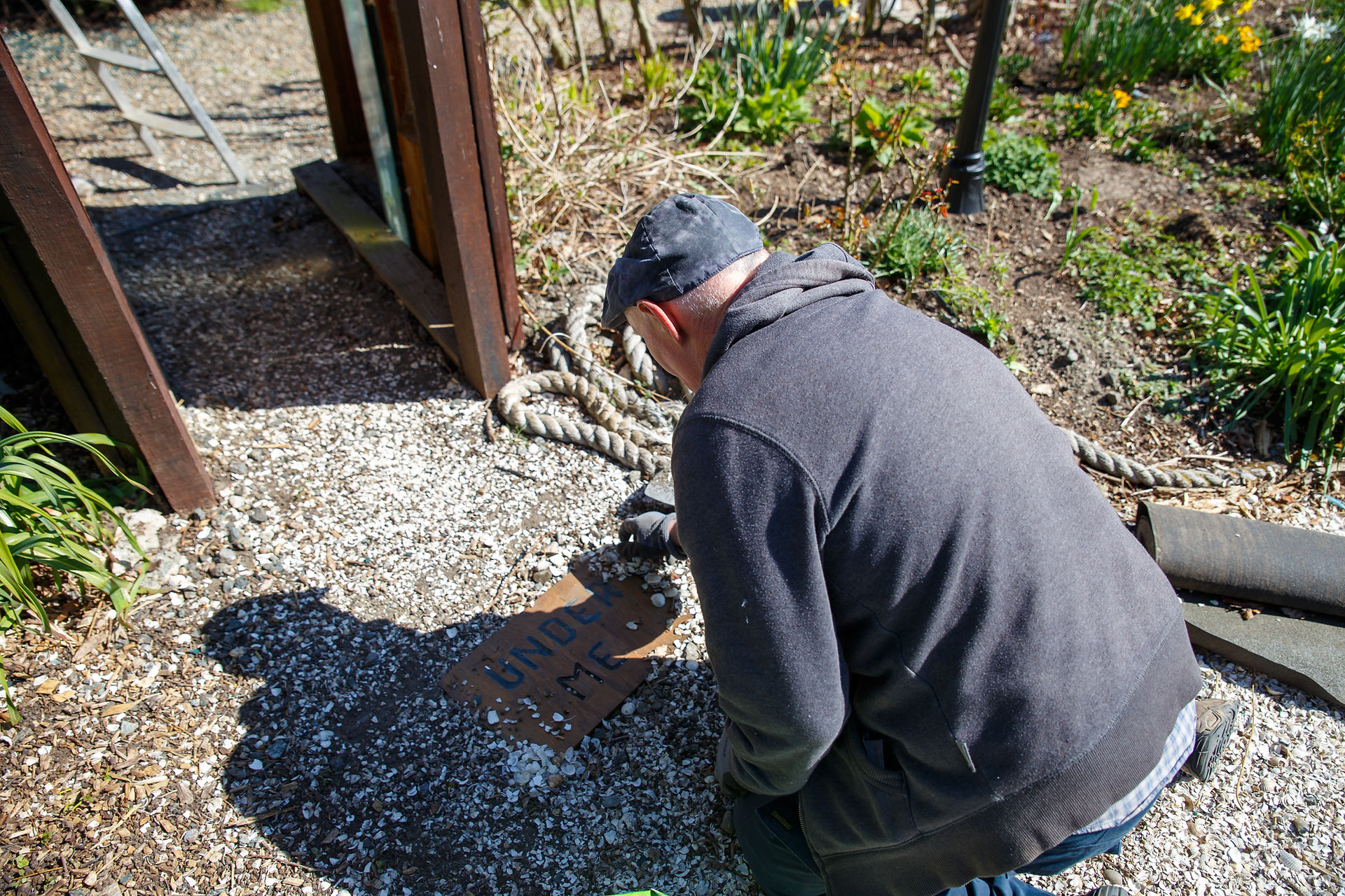 man creating pathway stone pathways