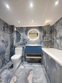 Refurbished bathroom with matte porcelain tiles, floating vanity, and Japanese bath in Holloway N7, London