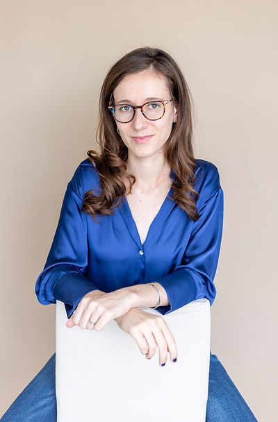 Sara sitting on a chair