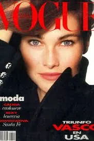 portada de revista donde se ve una mujer morena con ojos azules y un abrigo negro