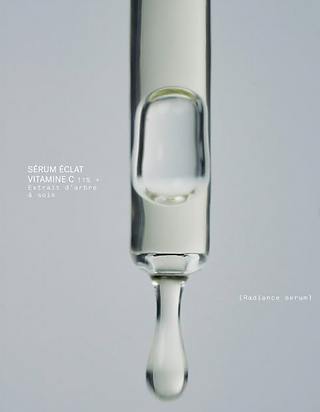 Drop of serum falling from the applicator