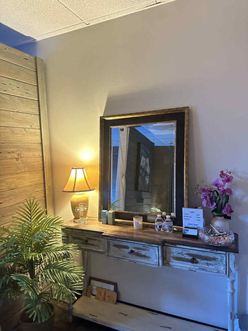 Desk with a mirror and lamp in the corner