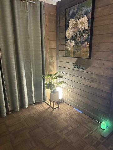 Corner with lamp on the floor and painting on the wall