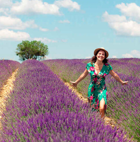 france-provence-valensole-plateau-happy-woman-walking-among-lavender-fields-in-summer-GEMF