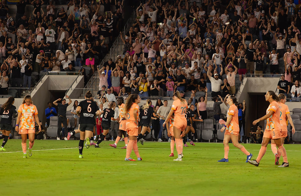 Angel City FC players celebrate after Alyssa Thompson’s late game-winning goal against Orlando Pride.