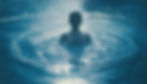 Image of a woman in a body of water with ripple effects extending in circles around her