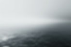 A grey sea against a grey sky