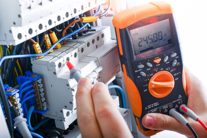 Technician using meter to read AHU outputs