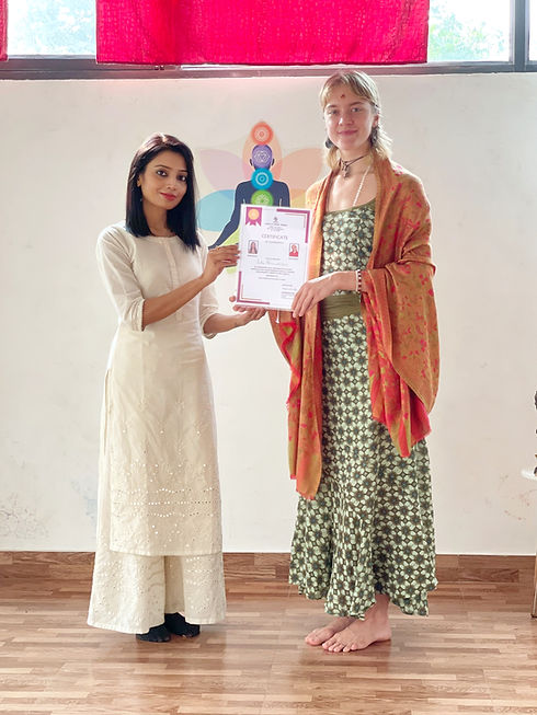 aarak-school-testimonial-page-student-receiving-healing-arts-certification-from-instructor