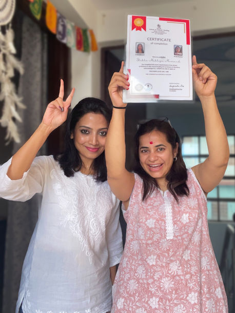 Reiki Master Sanghamitra celebrating a student's successful completion and certification of the Usui Reiki Master Teacher level.