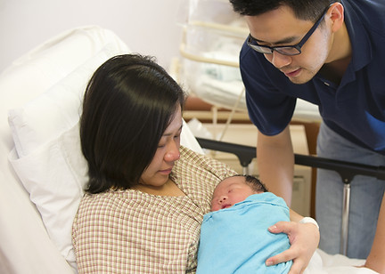 Asian chinese newborn baby girl and dadd