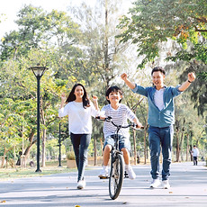 Happy Asian father and mother teach thei