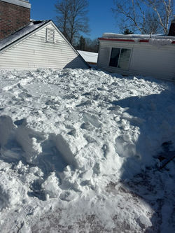 snow removal services on a residential roof