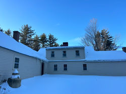 snow removal services on a residential roof
