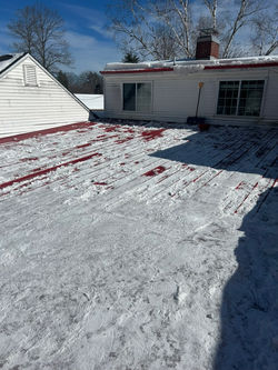 snow removal services on a residential roof