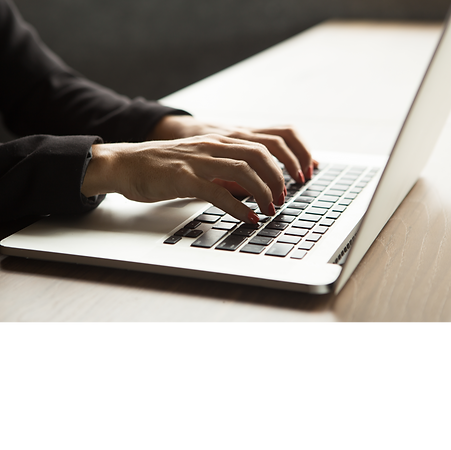 Person typing on a laptop.