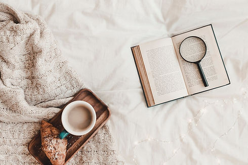 book-with-loupe-near-croissant-hot-drink-stand-placed-plaid_23-2147887767.jpg