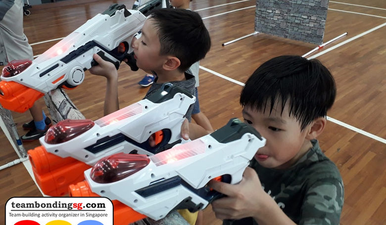 Tag team brothers working together in a Laser Tag game