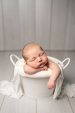 Relaxed newborn photography in our cosy East End Glasgow studio. Capturing your baby's first moments with care, creativity,