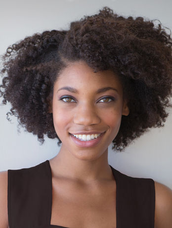 Black woman smiling, client testimonial 