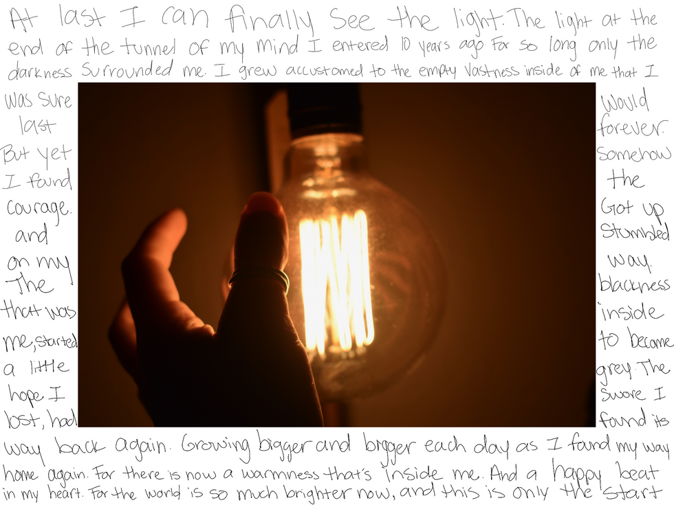 A hand reaching out to touch a circular old fashions light bulb with a poem