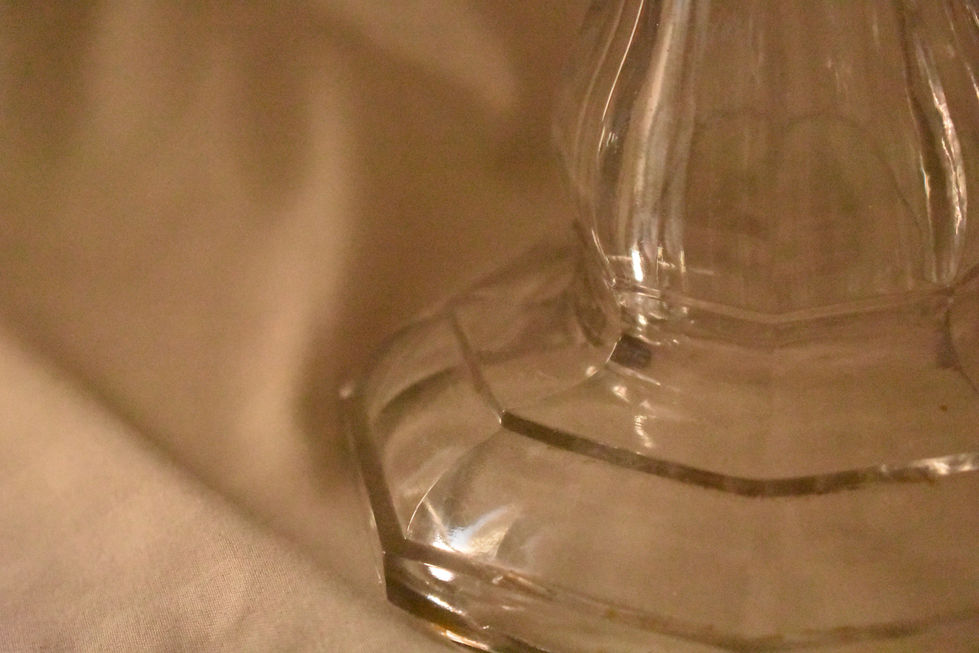 Base of an oil lamp creating a shadowing background