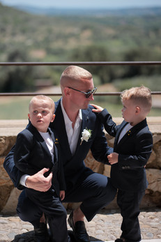 Groom and his three year old twin sons dressed in suits