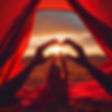 Red tent sunset flowing fabric four hands held together.jpg