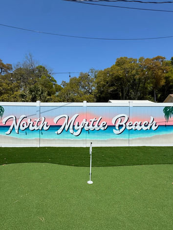 Custom North Myrtle Beach mural for a vacation rental featuring tropical flowers, palm trees, and a welcoming beach inspired design by Michelle Ricalde