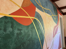 Multi colored abstract mural with gold accents painted by South Carolina artist, Michelle Ricalde