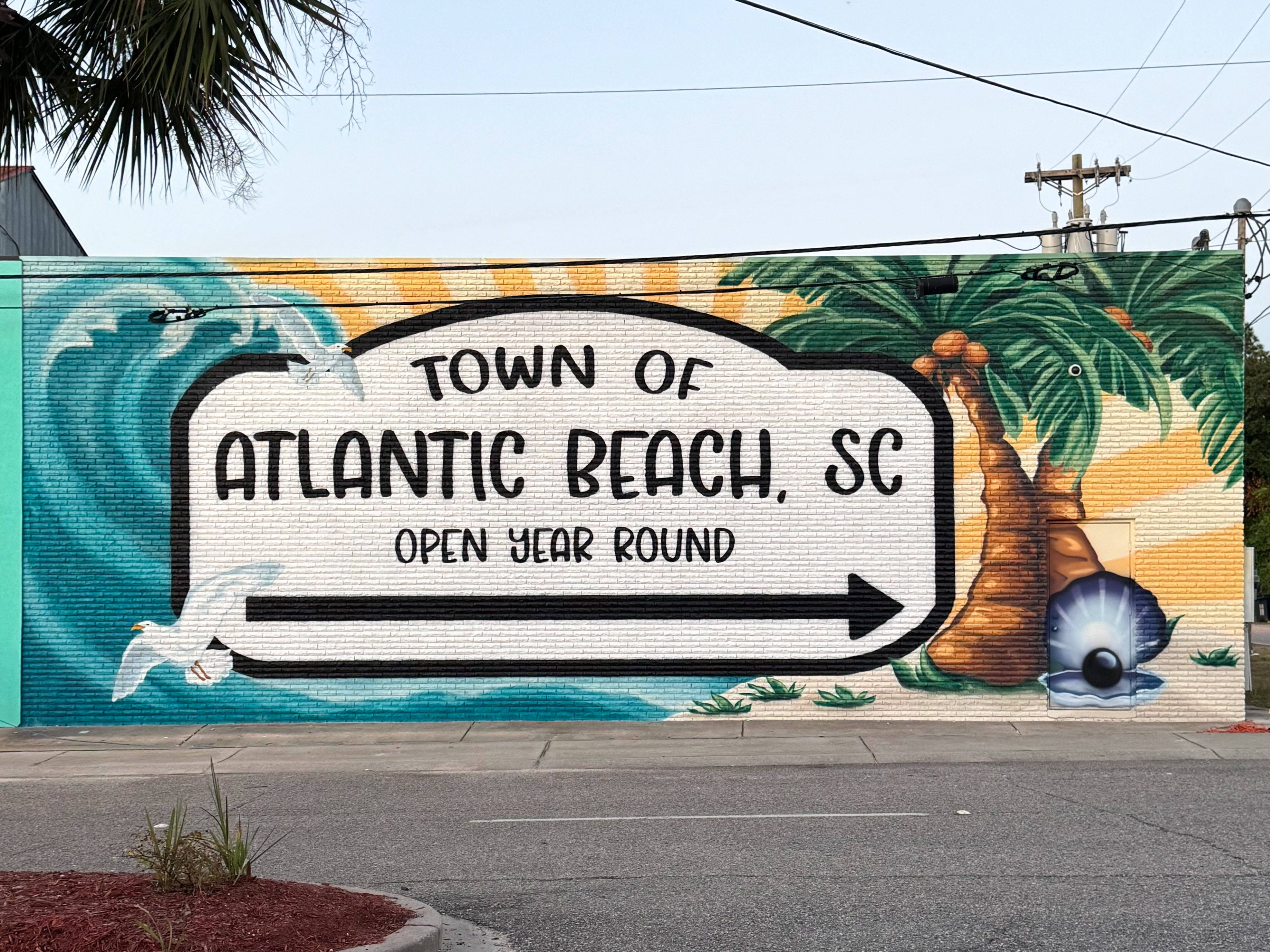 Large-scale public mural for the Town of Atlantic Beach, South Carolina, celebrating coastal culture and community