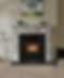 Marble fireplace with black Chesneys Sanctuary wood burning stove lit, radiating warmth in cozy room. Abstract painting above, plants and chair nearby on wooden floor.