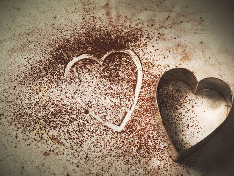 A heart-shaped cookie cutter on dough