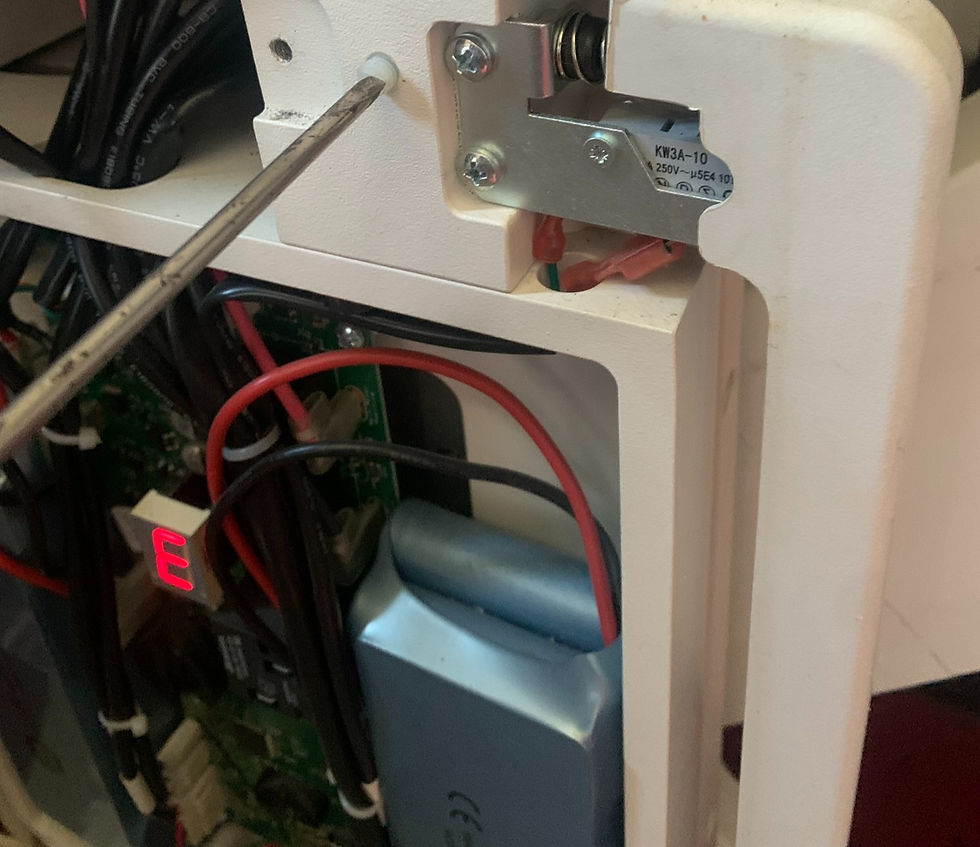 Removing seat holding screw.