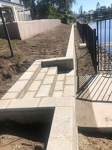 Concrete block retaining wall with built in stairs  Gold Coast SP Landscape Constructions.